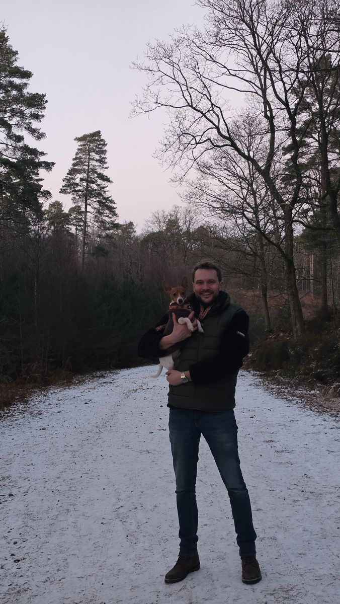 Sam and Ozzie, his dog, on a frosty woodland track